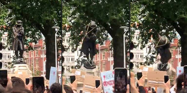 Demonstranten werfen Statue von Sklavenhändler ins Wasser
