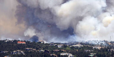 Waldbrände zwingen Tausende zur Flucht