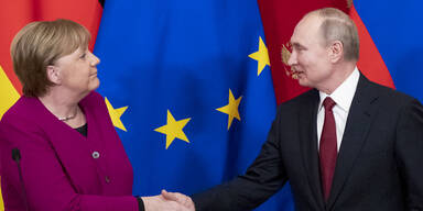 Merkel und Putin verteidigen Iran-Atomabkommen